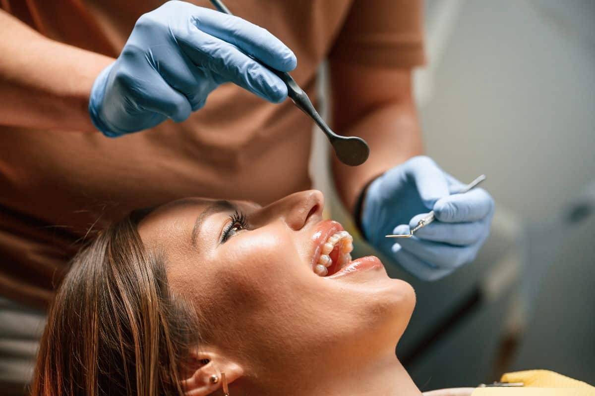 dentist treating a female dental patients at Phoenix dental office