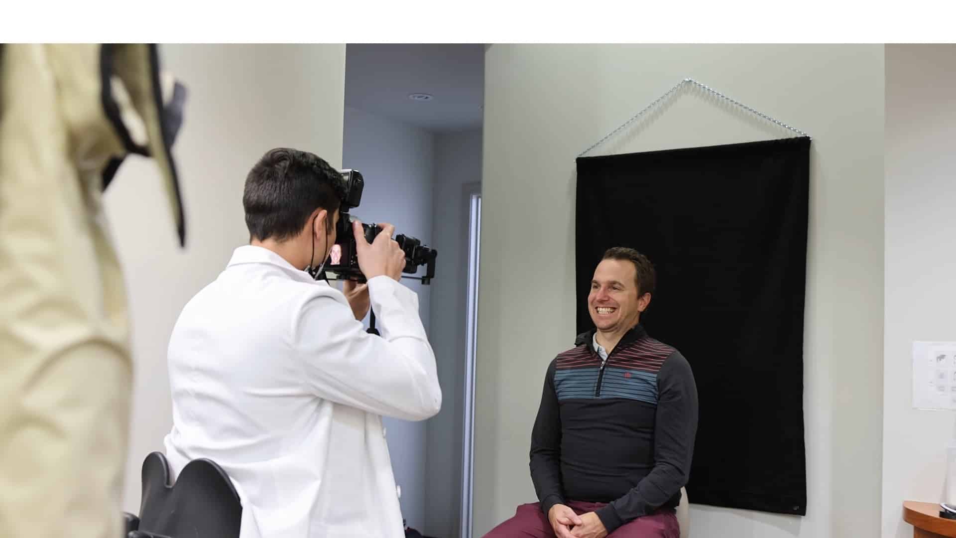 Dr. Harris taking a photograph after completing dental treatment in Phoenix