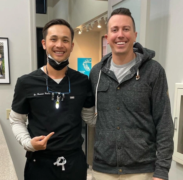 Dr. Brandon Harris with a patient at Biltmore Cosmetic & Restorative Dentistry